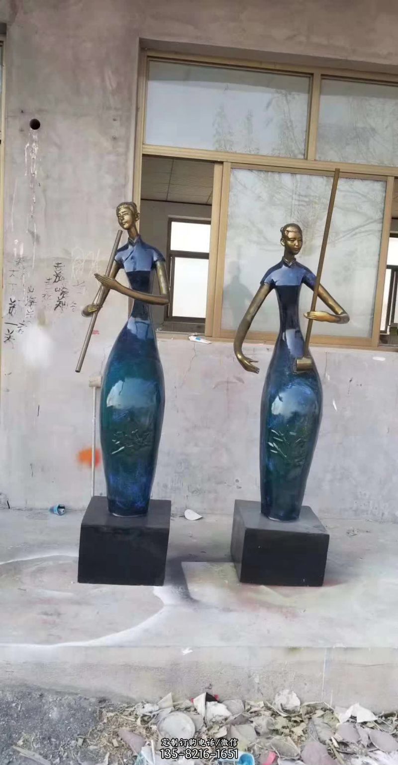 弹乐器的抽象人物铜雕塑 弹乐器的抽象人物铜雕塑