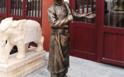 饭店门口仿铜小二迎宾玻璃钢雕塑